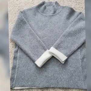 Grey cashmere and wool mock turtleneck sweater.